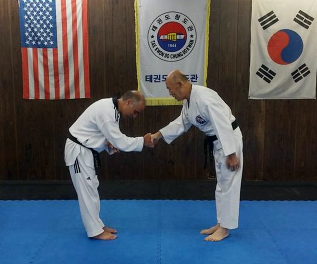 Dan getting his 6th-degree black belt.